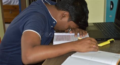 Exhausted Millennial Male Laying On The Table While Sitting At