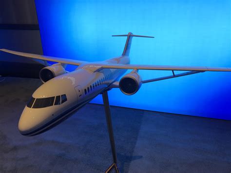 a model airplane on display in front of a blue background