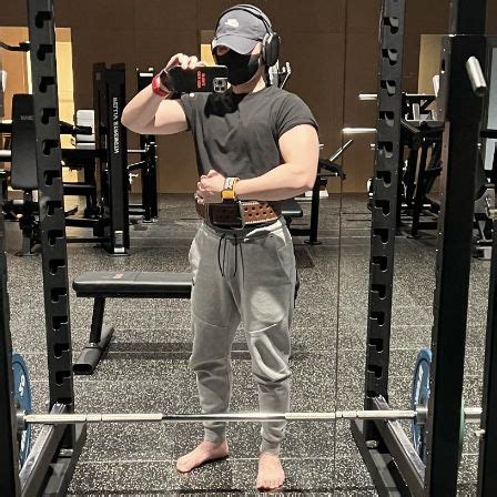 A Man Taking A Photo In The Gym