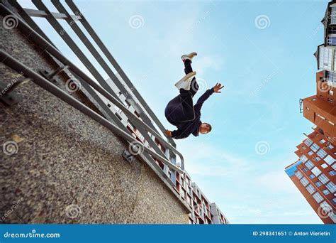 Athlete Man Young Guy Jumping Flips Of Wall Practice Parkour In