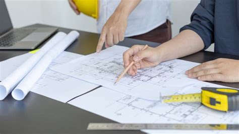 Meeting Of Engineers And Architects In Building Planning Stock Photo