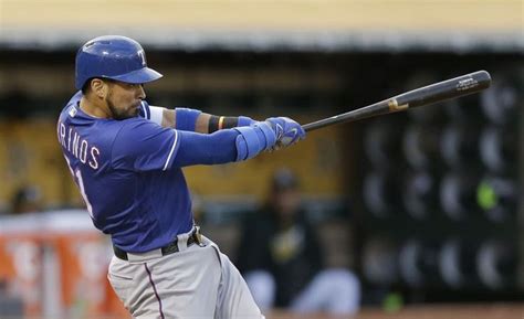 Texas Rangers Catcher Robinson Chirinos Swings For A Three Run Home