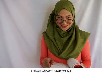 Beautiful Asian Muslim Woman Holding Book Stock Photo 2216798325