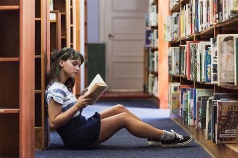 Reading Girl Sitting On Library Floor Photo Free Download