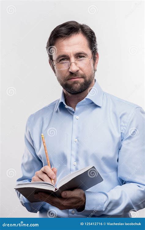 Serious Bearded Mature Man Wearing Glasses Holding Pencil Making Notes