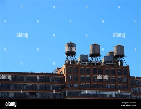 Three Water Tanks On Roof Top Of Building Stock Photo Alamy