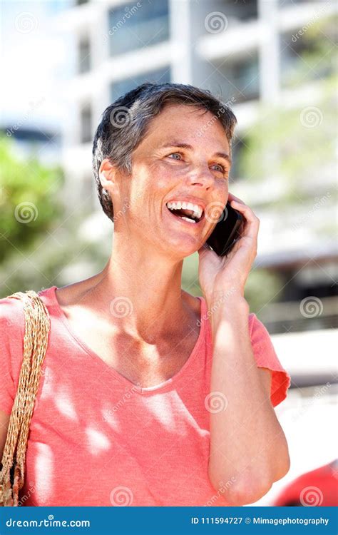 Happy Mature Woman Talking On Mobile Phone Outdoors Stock Image Image