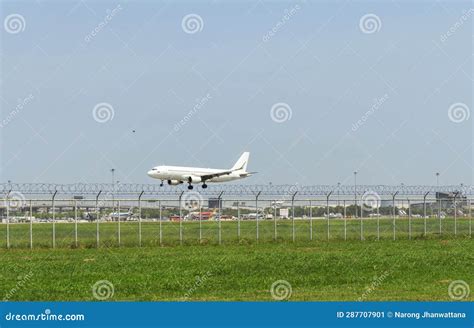 White Airplane is landing editorial photo. Image of business - 287707901