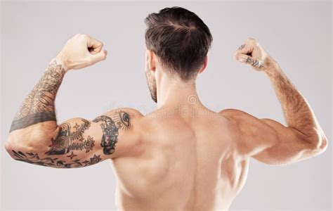 Back Of Muscular Young Bodybuilder In Relaxed Pose Stock Photo Image