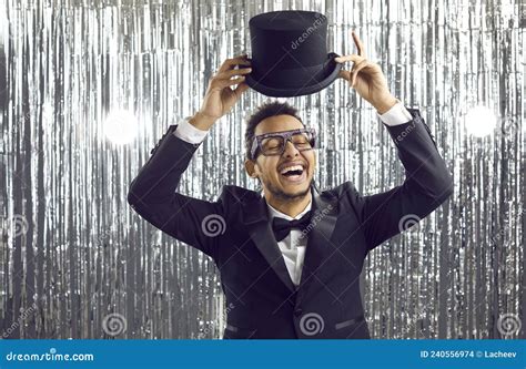 Happy Cheerful Young Man In Black Tuxedo And Top Hat Laughing And