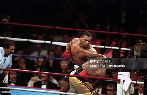 Mike Tyson land a punch against Buster Mathis Jr. during the fight at ...