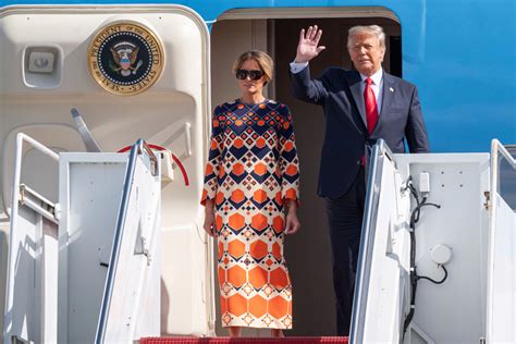 Melania Trump steps out in $3,700 orange dress after landing in Florida ...