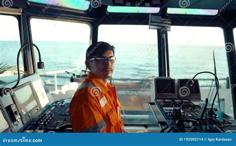 Filipino Deck Officer On Bridge Of Vessel Or Ship He Is On Watch Stock