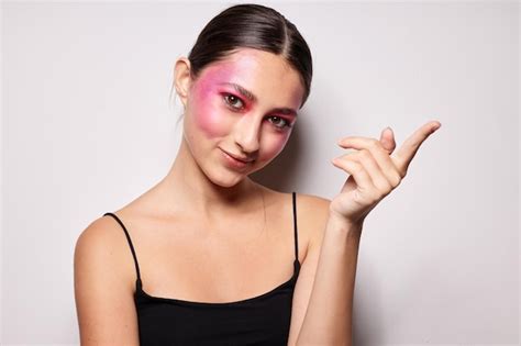 Premium Photo Sexy Brunette Woman Pink Face Makeup Posing Attractive Look Light Background