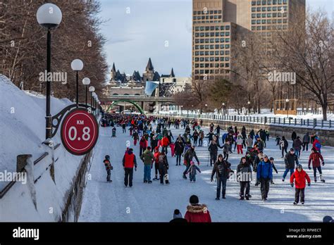 People celebrate the Winterlude festival on the frozen Rideau Canal ...