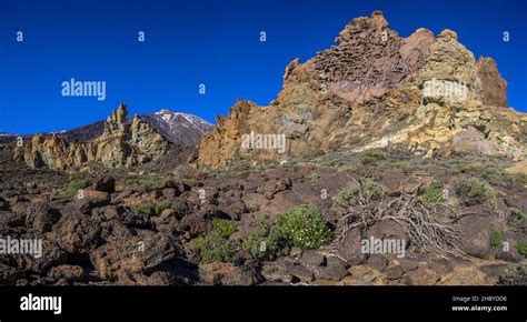 Colourful Rocks Of Roques De Garcia And Teide In The Background Las