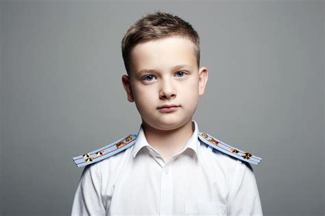 Premium Photo | Young officer handsome boy in uniform Police child