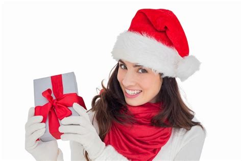 Premium Photo Excited Brunette In Santa Hat Showing Gift