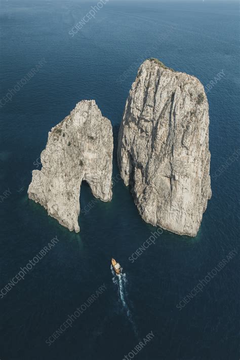 Aerial View Of Boats Sailing Near Capri S Faraglioni Italy Stock