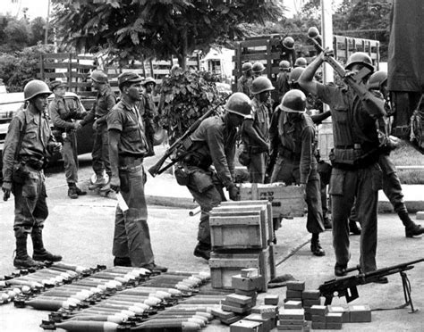 Venezuelan Army soldiers loading ammunition and weapons onto a truck in ...