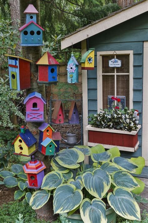 Colorful Birdhouse on tree trunk. - Modern Design | Bird houses ideas