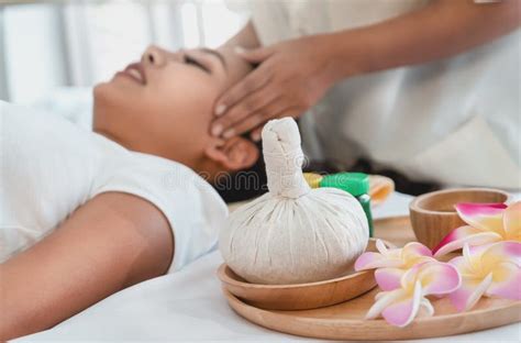 Woman Receiving Feet Push On Her Back For Thai Massage Stretching In A