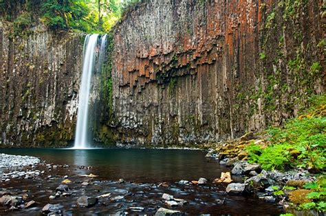 Water Falls Over Cliff Of Columnar Basalt