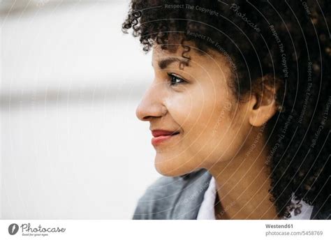 Profile of smiling woman with curly hair - a Royalty Free Stock Photo ...