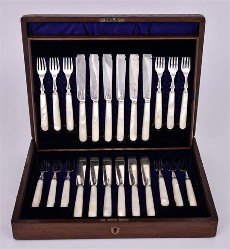 A Set Of Twelve Late Victorian Silver Bladed And Mother Of Pearl