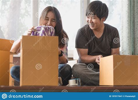 Concept Young Couple Moving House Asian Woman Helping Man Carry