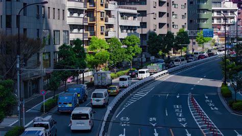 A Timelapse Of Traffic Jam At The City Street In Tokyo Telephoto Shot