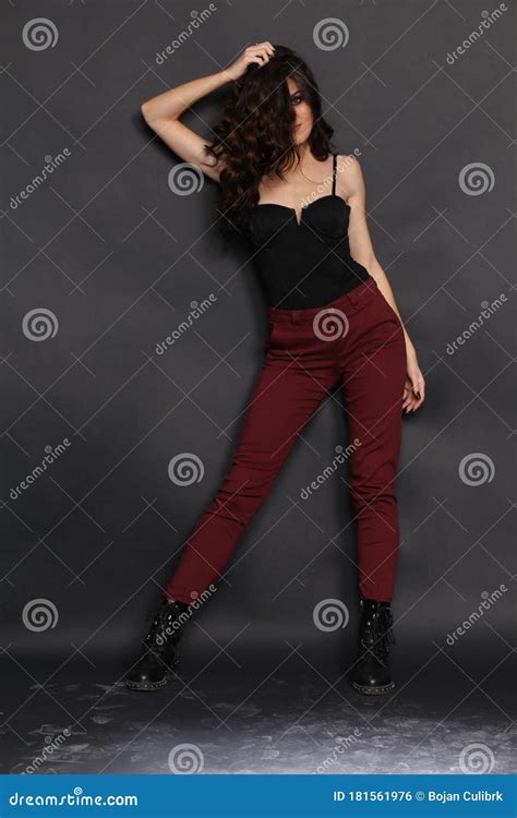 Beautiful Brunette Caucasian Girl With Long Hair Posing In Studio On Isolated Background Style