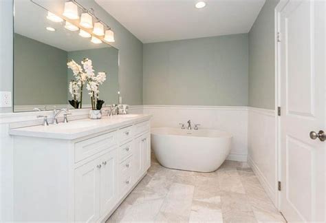 A Bathroom With A Large White Tub Next To A Walk In Shower And Two Sinks