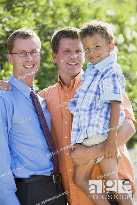 Gay Couple Smiling With Their Son Stock Photo Picture And Royalty Free Image Pic GOG