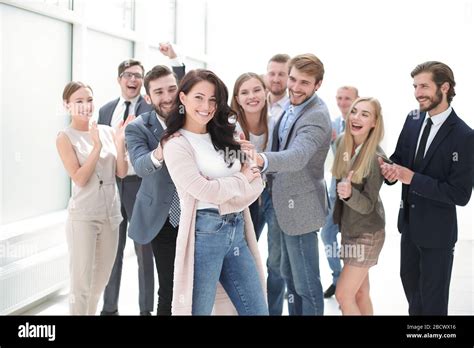 Business Team Congratulating Their Leader Success Concept Stock Photo