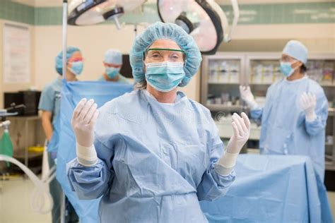 Doctor In Surgical Gown With Team At Operation Stock Image Image Of