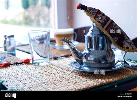 Moroccan Tea With Mint And Sugar In A Glasses On A Copper Plate With