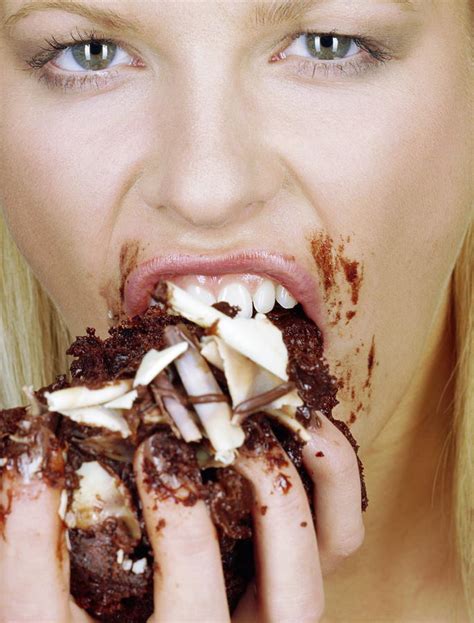 Woman Eating Cake Photograph By Jason Kelvin Science Photo Libray