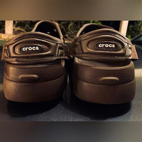 Brown CROCS with a neat, flexible strap design that... - Depop