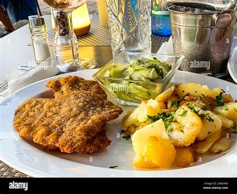 Original Viennese Veal Escalope With Fried Potatoes And Cucumber Salad Port Andratx Majorca