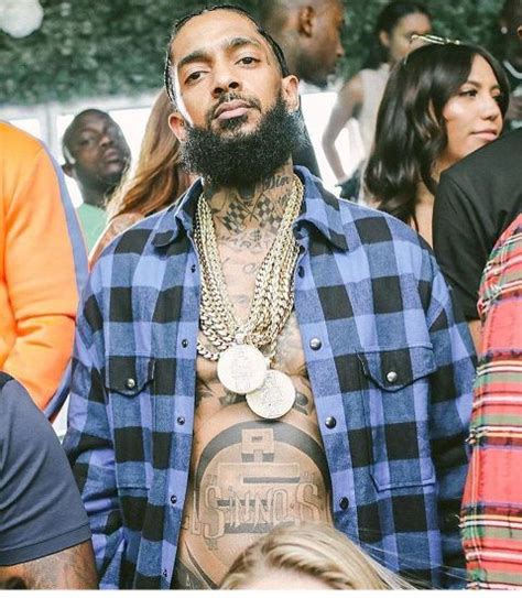 Nipsey Hussle’s 31 Tattoos & Their Meaning – Body Art Guru