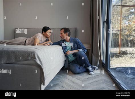 Caring Mature Man With Wife Relaxing At Home Stock Photo Alamy