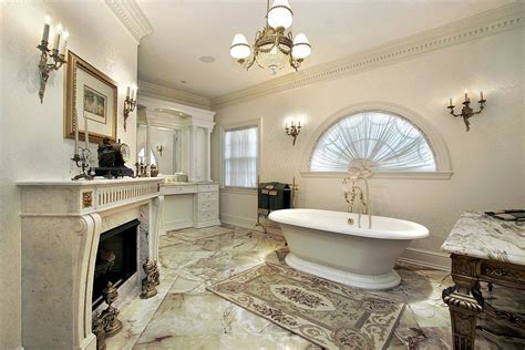 An elegant master bathroom with a fireplace and a very stylish flooring ...