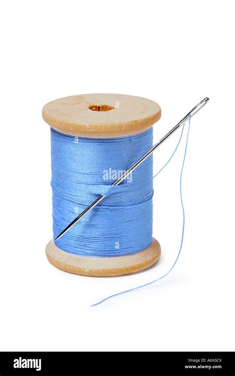 Spool Of Thread And Needle Cut Out On White Background Stock Photo Alamy