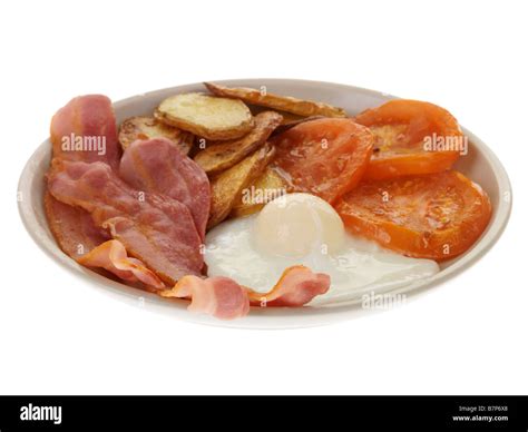 Cooked Breakfast With Streaky Bacon And Poached Egg Stock Photo Alamy