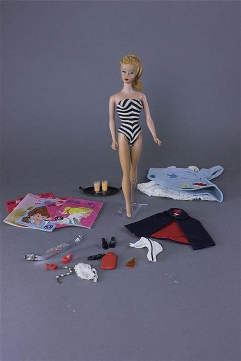 Lot BLONDE PONYTAIL BARBIE WITH MISCELLANEOUS ARTICLES OF CLOTHING AS SHOWN DOLL S HAIR IN