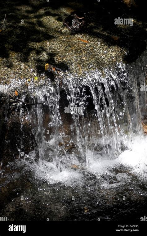 A Beautiful Little Waterfall Section Of A Flowing Brook Stock Photo Alamy