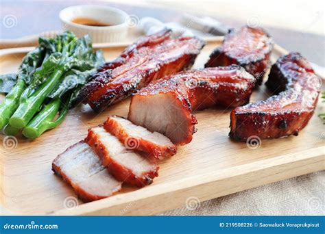 Char Siu Honey Barbecue Roast Pork On Wood Tray Of Wood Table