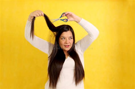 40 Year Old Latina Woman With Very Long Straight Hair Wants To Cut Her Hair With Scissors Stock