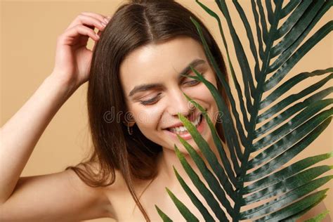 Close Up Brunette Half Naked Woman 20s With Perfect Skin Nude Make Up Palm Leaf Isolated On